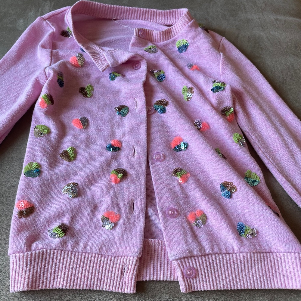 Sparkling pink sweater.